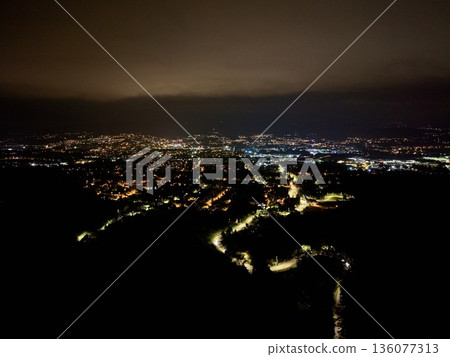 Night City Lights, Tranquil Cityscape Captured At Night From Drone With Peaceful Illuminated Streets Night City Lights, Tranquil Cityscape Captured At Night From Drone With Peaceful Illuminated Streets 136077313