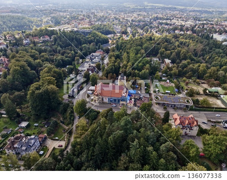 Historic Settlement Amid Green Hills, Traditional Village Surrounded By Lush Woodland Landscapes Historic Settlement Amid Green Hills, Traditional Village Surrounded By Lush Woodland Landscapes 136077338