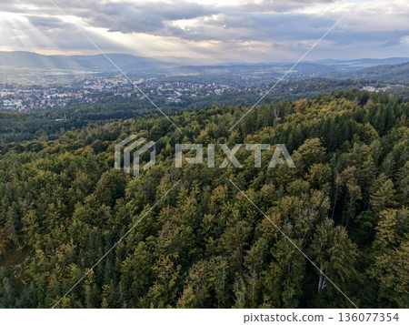 Sunlight Over Landscape, Sunbeams Breaking Through Clouds Illuminate Remote Mountain Village Scenery Sunlight Over Landscape, Sunbeams Breaking Through Clouds Illuminate Remote Mountain Village Scenery 136077354