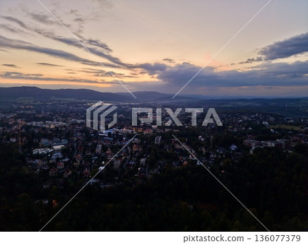 Vibrant Sunset Panorama, Colorful Sunset Over Cityscape, Dramatic Evening Sky Highlights City Silhouette Vibrant Sunset Panorama, Colorful Sunset Over Cityscape, Dramatic Evening Sky Highlights City Silhouette 136077379