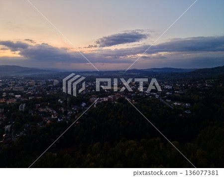 Serene Evening Above Neighborhood Hills, Peaceful Twilight Over Residential Landscapes And Treetops 136077381