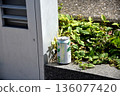 Empty cans discarded on the side of the road 136077420