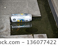 Aluminum cans floating in a gutter after being discarded 136077422