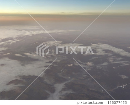 Winter terrain with contrasting snow and earth, Frozen landscape featuring snow patches and rugged ridges Winter terrain with contrasting snow and earth, Frozen landscape featuring snow patches and rugged ridges 136077453