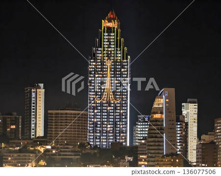 Luminous urban tower, Vivid metropolitan skyline showcasing radiant highrise buildings in city center Luminous urban tower, Vivid metropolitan skyline showcasing radiant highrise buildings in city center 136077506