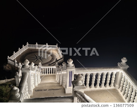 Elegant staircase with romantic ambiance, Artistic stone staircase and cover establish romantic scene Elegant staircase with romantic ambiance, Artistic stone staircase and cover establish romantic scene 136077509