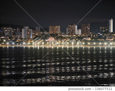 City night scene, Nighttime urban shoreline with sparkling reflections and lively illumination City night scene, Nighttime urban shoreline with sparkling reflections and lively illumination 136077512