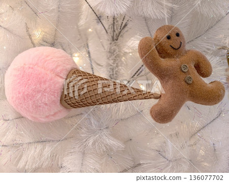 Festive holiday decorations, Decorative holiday display featuring pink cones and gingerbread decorations Festive holiday decorations, Decorative holiday display featuring pink cones and gingerbread decorations 136077702