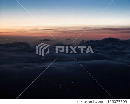 Relaxing twilight scene showcasing pastel shades blending over distant horizon and tranquil sea Relaxing twilight scene showcasing pastel shades blending over distant horizon and tranquil sea 136077709