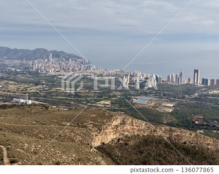 Seaside panorama with hills and water, Expansive coastal vista with hills and shimmering sea 136077865