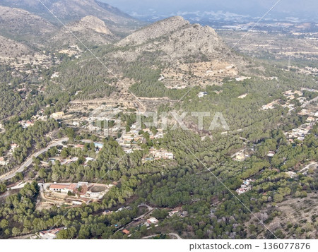 Sunny hillside homes, Hillside dwellings with gardens and panoramic landscape views for storytelling Sunny hillside homes, Hillside dwellings with gardens and panoramic landscape views for storytelling 136077876