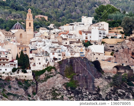 Village over canyon, Serene mountain village featuring traditional white houses and scenic views Village over canyon, Serene mountain village featuring traditional white houses and scenic views 136078005