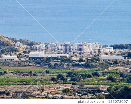 Coastal landscape with hills and sea, Tranquil coastline featuring rolling hills and reflective waters Coastal landscape with hills and sea, Tranquil coastline featuring rolling hills and reflective waters 136078007