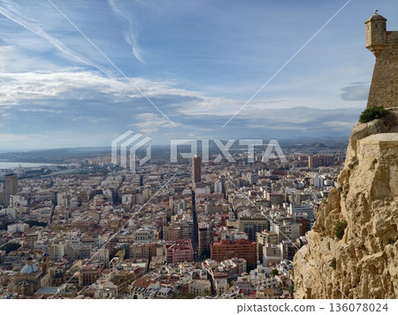 Old watchtower amid scenic coast, Historic tower with views of city and sea highlighting history Old watchtower amid scenic coast, Historic tower with views of city and sea highlighting history 136078024