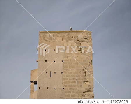 Ancient sandstone structure with solitude, Eroded structure featuring vertical lines and peaceful ambiance 136078029