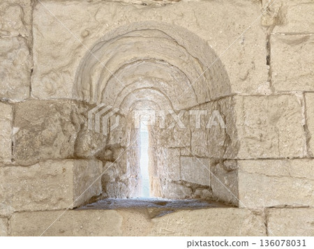 Serene setting showcasing carved niche with gentle illumination and ancient craftsmanship details 136078031