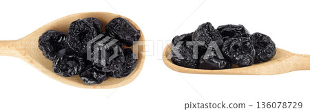 Prunes in wooden spoon isolated on white background, heap of dried plums. Top view. Flat lay Prunes in wooden spoon isolated on white background, heap of dried plums. Top view. Flat lay 136078729