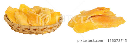 dried mango in a wicker basket isolated on white background dried mango in a wicker basket isolated on white background 136078745