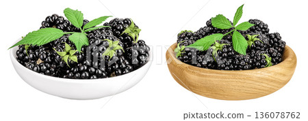 blackberry with leaf in ceramic and wooden bowl isolated on a white background closeup. 136078762
