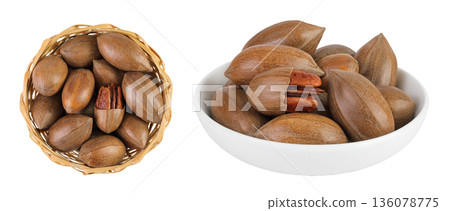 pecan nut in a wicker basket isolated on white background with full depth of field. Top view. Flat lay. pecan nut in a wicker basket isolated on white background with full depth of field. Top view. Flat lay. 136078775