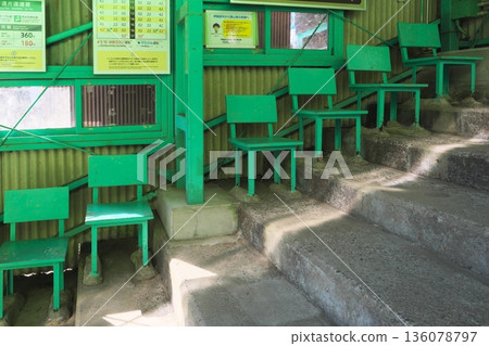 Green benches lined up in a staircase at Daisen Cable Daisenji Station Green benches lined up in a staircase at Daisen Cable Daisenji Station 136078797