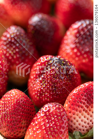 Fresh organic strawberry with green leaf texture background Fresh organic strawberry with green leaf texture background 136079164