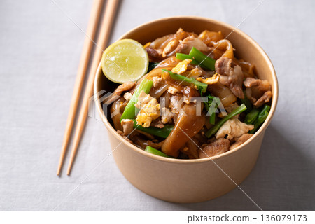 Thai food (Pad See Ew), Stir-fried rice noodles with soy sauce, pork, egg, and kale Thai food (Pad See Ew), Stir-fried rice noodles with soy sauce, pork, egg, and kale 136079173