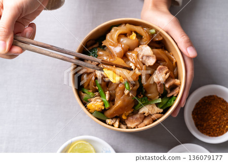 Thai food (Pad See Ew), Stir-fried rice noodles with soy sauce, pork, egg, and kale Thai food (Pad See Ew), Stir-fried rice noodles with soy sauce, pork, egg, and kale 136079177