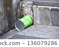 Empty cans discarded in the staircase drain 136079286