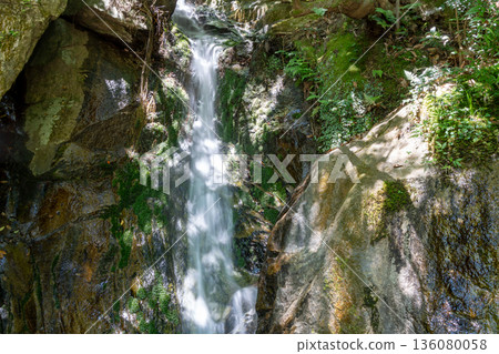 Waterfall at Mitaki-Dera temple in Hiroshima surrounded by mossy rocks Waterfall at Mitaki-Dera temple in Hiroshima surrounded by mossy rocks 136080058
