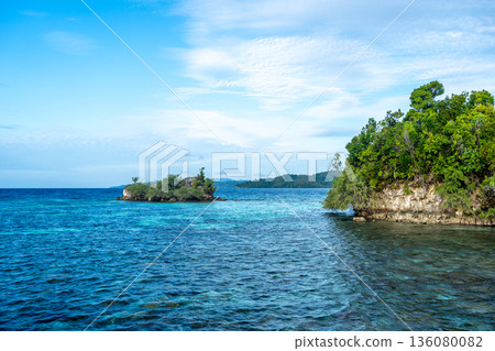 Coastline and turquoise waters of Malenge Island, Sulawesi, Indonesia Coastline and turquoise waters of Malenge Island, Sulawesi, Indonesia 136080082