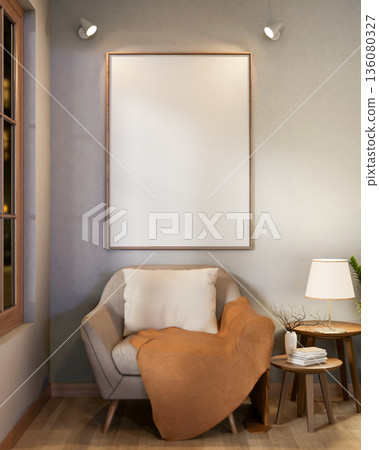 Blank frame with spotlight on wall over sofa chair with blanket and side table in a cafe or lounge. Blank frame with spotlight on wall over sofa chair with blanket and side table in a cafe or lounge. 136080327