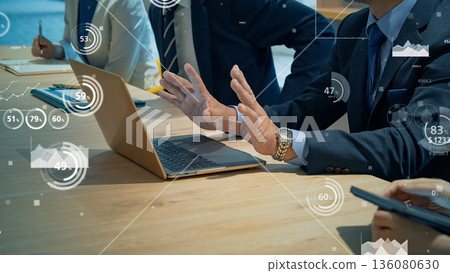 Multinational business people in a meeting and statistical data 136080630