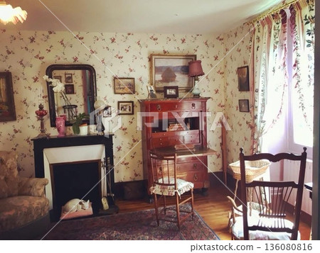 Monet's bedroom in Giverny, France, surrounded by floral wallpaper and antique furniture Monet's bedroom in Giverny, France, surrounded by floral wallpaper and antique furniture 136080816