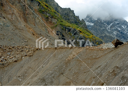 Chalaadi Glacier, ice, moraine and snow in the Caucasus Mountains in autumn, Mestia, Svaneti, Georgia. Chalaadi Glacier, ice, moraine and snow in the Caucasus Mountains in autumn, Mestia, Svaneti, Georgia. 136081103