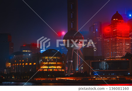 Stunning night view of Shanghai skyline showcasing vibrant neon lights. 136081160