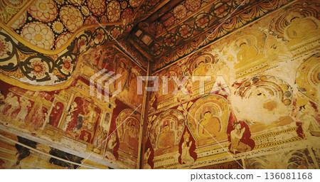 Ornate ceiling and wall murals with Buddha figures and decorative patterns in Yatagala Rajamaha Viharaya Ornate ceiling and wall murals with Buddha figures and decorative patterns in Yatagala Rajamaha Viharaya 136081168