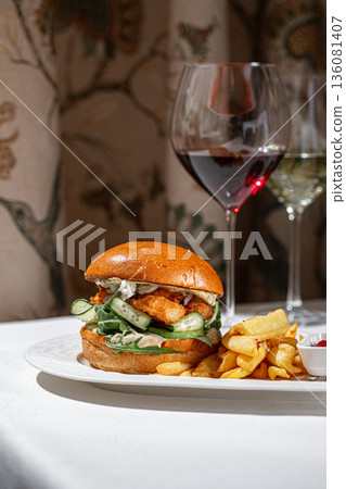 Shrimp burger with fries and wine pairing 136081407