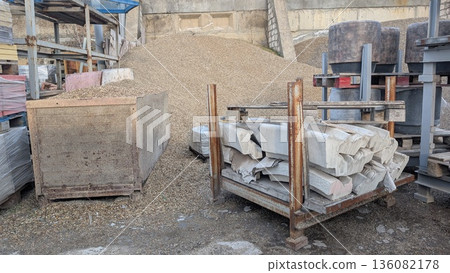 Labor environment featuring gravel mounds and packed masonry units Labor environment featuring gravel mounds and packed masonry units 136082178
