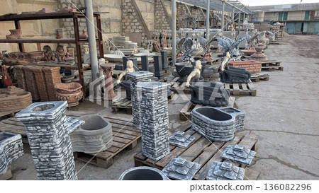 Concrete molds for yard decoration located on the territory of the manufacturer's factory 136082296