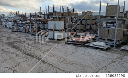 Structure housing arranged concrete blocks and heavy machinery Structure housing arranged concrete blocks and heavy machinery 136082298