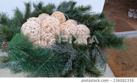 Artisanmade pine ornaments showcasing soft lighting and detailed weaving 136082338