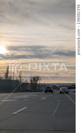 Early morning glow casting warmth on open road and horizon Early morning glow casting warmth on open road and horizon 136082356
