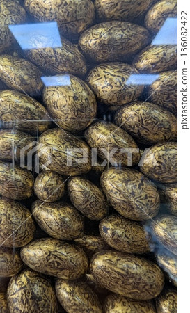 Exquisite Collection Of Gilded Decorative Eggs Featuring Elaborate Designs In Refined Display Setting 136082422