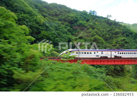 View from the Yamagata Shinkansen train window: E3 Series Tsubasa (between Fukushima Station and Yonezawa Station) 136082455