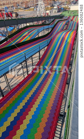 Bright Race Tracks Unite As Friends Compete Amidst Energetic Fair Ambiance And Attentive Operator Bright Race Tracks Unite As Friends Compete Amidst Energetic Fair Ambiance And Attentive Operator 136082488