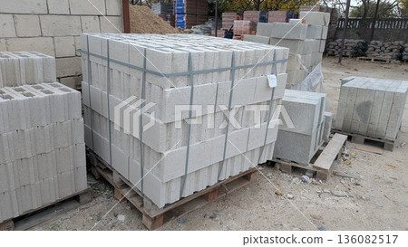 Industrial Yard With Concrete Blocks On Pallets Ready For Shipment Or Storage For Construction Industrial Yard With Concrete Blocks On Pallets Ready For Shipment Or Storage For Construction 136082517