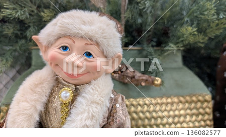 Artisan Crafted Elf Figurine Surrounded By Lush Plants With Ornate Jewelry And Cozy Apparel Artisan Crafted Elf Figurine Surrounded By Lush Plants With Ornate Jewelry And Cozy Apparel 136082577