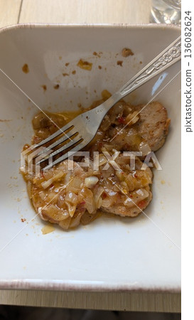 A Savory Shrimp Dish that is Served with a Delicious Sauce and a Fancy Fork for Eating A Savory Shrimp Dish that is Served with a Delicious Sauce and a Fancy Fork for Eating 136082624