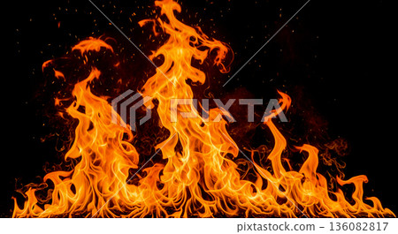 Bright orange fire flames isolated black background burning hot energy texture bonfire spark abstract design element wallpaper inferno danger concept Bright orange fire flames isolated black background burning hot energy texture bonfire spark abstract design element wallpaper inferno danger concept 136082817